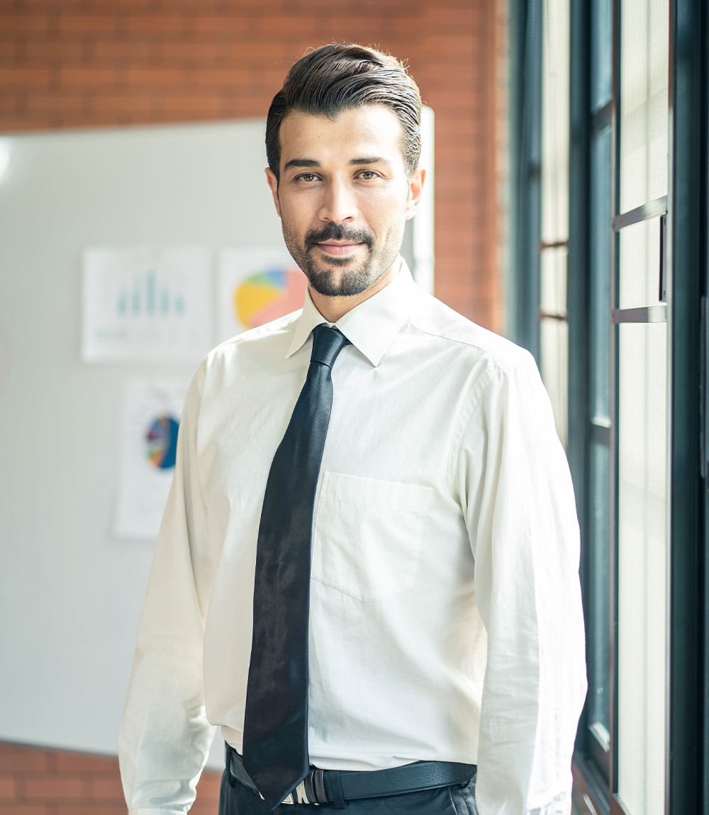 caucasian businessman standing and smile in meetin GQBLE64 1